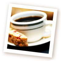 A Cup of Brewed Coffee with Biscotti